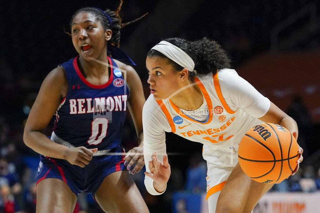Mark Humphrey Tennessee's Rae Burrell (12) moves the ball past Belmont's Tuti Jones (0) in the second half of a women's college basketball game in the second round of the NCAA tournament Monday, March 21, 2022, in Knoxville, Tenn. (AP Photo/Mark Humphrey)