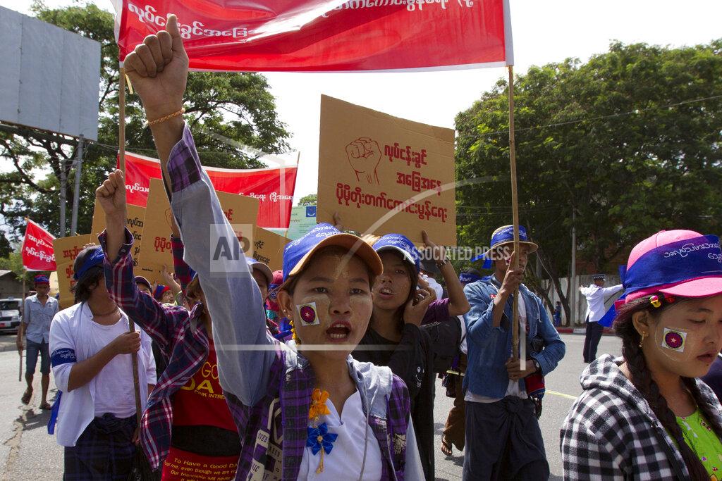 Uncredited FILE - In this May 1, 2018, file photo, Myanmar workers, mostly from garment and shoe factories, take part in a May Day march in Yangon, Myanmar. Garment workers in Myanmar are urging major international brands to denounce the recent military coup there and put more pressure on factories to protect workers from being fired or harassed — or worse arrested and killed for participating in protests. (AP Photo, File)