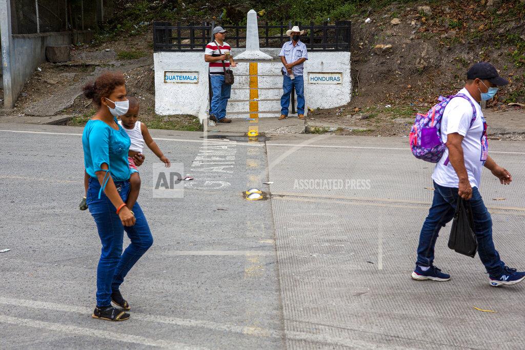 Oliver De Ros Honduran migrants return to their country of origin at the border crossing in El Florido, Guatemala, Tuesday, Jan. 19, 2021. A once large caravan of Honduran migrants that pushed its way into Guatemala last week had dissipated by Tuesday in the face of Guatemalan security forces. (AP Photo/Oliver de Ros)
