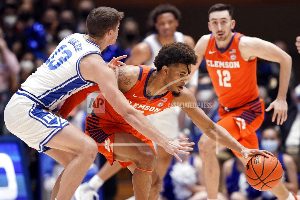 Gerry Broome Duke forward Joey Baker (13) guards Clemson guard David Collins during the first half of an NCAA college basketball game in Durham, N.C., Tuesday, Jan. 25, 2022. (AP Photo/Gerry Broome)