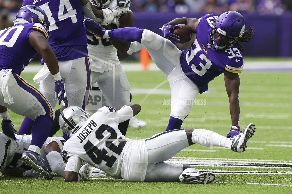 Jim Mone Minnesota Vikings running back Dalvin Cook (33) is upended by Oakland Raiders free safety Karl Joseph (42) during the first half of an NFL football game, Sunday, Sept. 22, 2019, in Minneapolis. (AP Photo/Jim Mone)