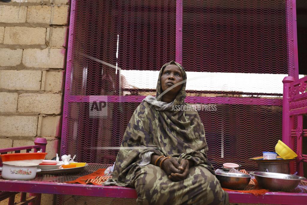 Marwan Ali Saadia Ahmed, mother of the Sudanese migrant Mutawakel Ali, sits at her home, in Khartoum, Sudan, Friday April 30, 2021. Ali narrowly missed drowning in Libya because he was late for the boat’s departure. The rubber boat when on to sink at sea on approximately April 21, and its more than 100 passengers drowned. (AP Photo/Marwan Ali)