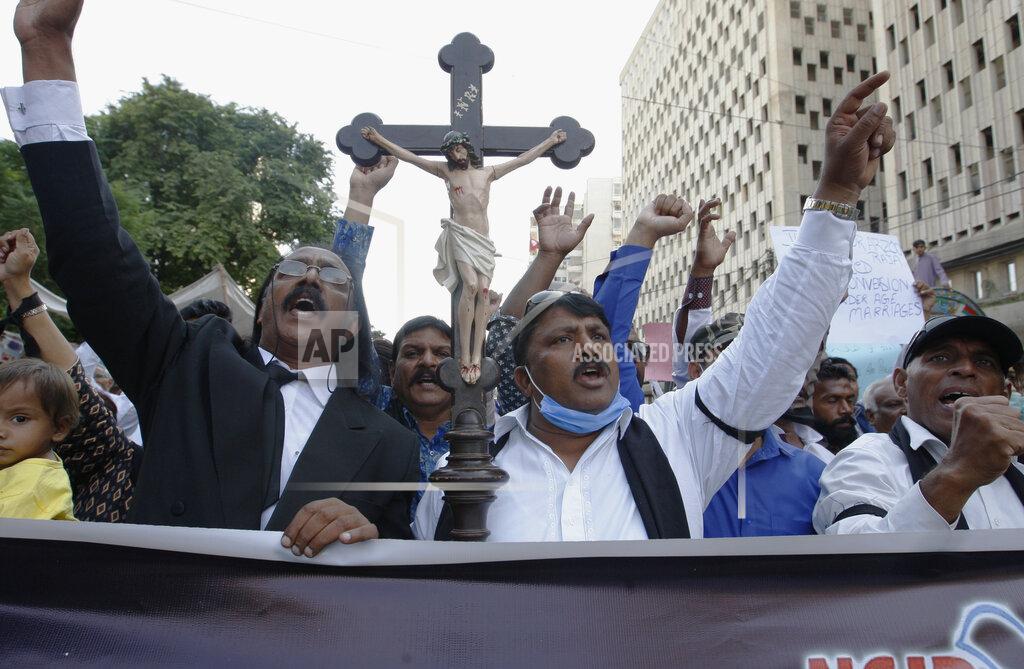 Fareed Khan Christians demonstrate against child marriage and forced conversion, in Karachi, Pakistan, on Sunday, Nov. 8, 2020. Nearly 1,000 non-Muslim girls are forced to convert to Islam in Pakistan each year, largely to pave the way for marriages that are under the legal age and non-consensual. (AP Photo/Fareed Khan)