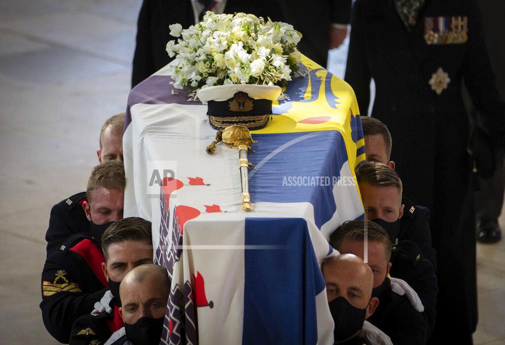 Danny Lawson Pall Bearers carry the coffin during the funeral of the Duke of Edinburgh in St George's Chapel, Windsor Castle, in Windsor, England, Saturday April 17, 2021. Prince Philip died April 9 at the age of 99 after 73 years of marriage to Britain's Queen Elizabeth II. (Danny Lawson/Pool via AP)