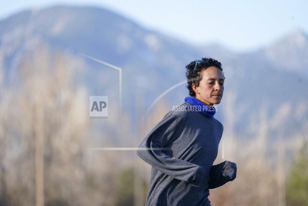 David Zalubowski Runner Maggie Montoya is shown as she trains with fellow runners at a park on the east side of Boulder, Colo., Friday, April 9, 2021. The Olympic hopeful was working in the pharmacy at the King Soopers supermarket in Colorado on March 22 when 10 people were killed in the mass shooting. The next day, Montoya was picked up by her dad and taken home to Arkansas. It was a chance to be with family and remember those who lost their lives.(AP Photo/David Zalubowski)