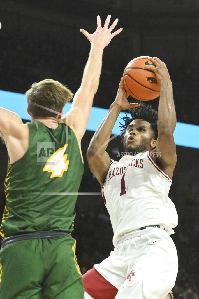 Michael Woods Arkansas guard Ricky Council IV (1) shoots over North Dakota State guard forward Grant Nelson (4) during the second half of an NCAA college basketball game Monday, Nov. 7, 2022, in Fayetteville, Ark. (AP Photo/Michael Woods)