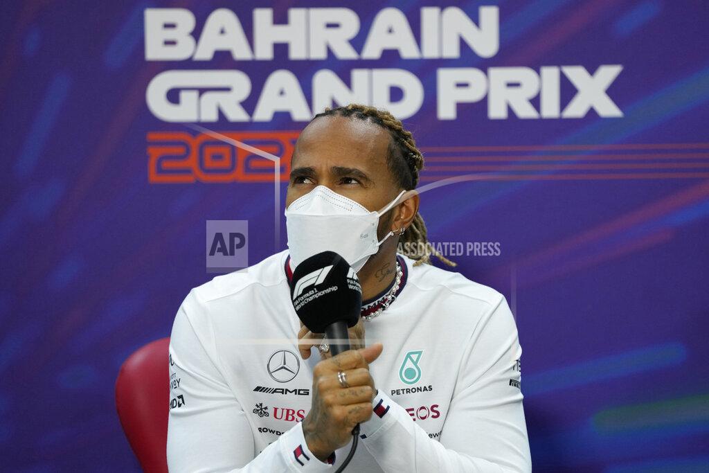 Hassan Ammar Mercedes driver Lewis Hamilton of Britain speaks during a press conference at the Formula One Bahrain International Circuit in Sakhir, Bahrain, Friday, March 18, 2022. The Bahrain Formula One Grand Prix will take place here on Sunday. (AP Photo/Hassan Ammar)