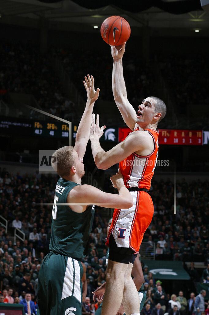 Al Goldis Illinois' Giorgi Bezhanishvili, right, shoots over Michigan State's Thomas Kithier during the first half of an NCAA college basketball game Thursday, Jan. 2, 2020, in East Lansing, Mich. (AP Photo/Al Goldis)