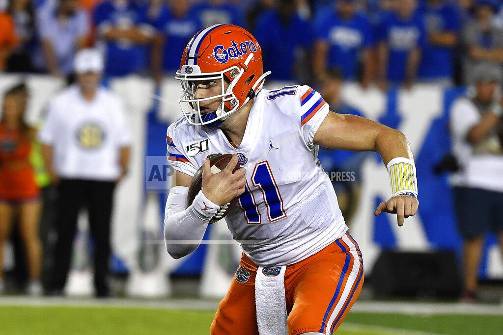 Timothy D. Easley FILE - In this Sept. 14, 2019, file photo, Florida quarterback Kyle Trask (11) is shown running during the second half of an NCAA college football game in Lexington, Ky. With a collective seven career starts between them, No. 7 Auburn's quarterback Bo Nix and No. 10 Florida's Kyle Trask are set to face off in a Top 10 showdown. (AP Photo/Timothy D. Easley, File)