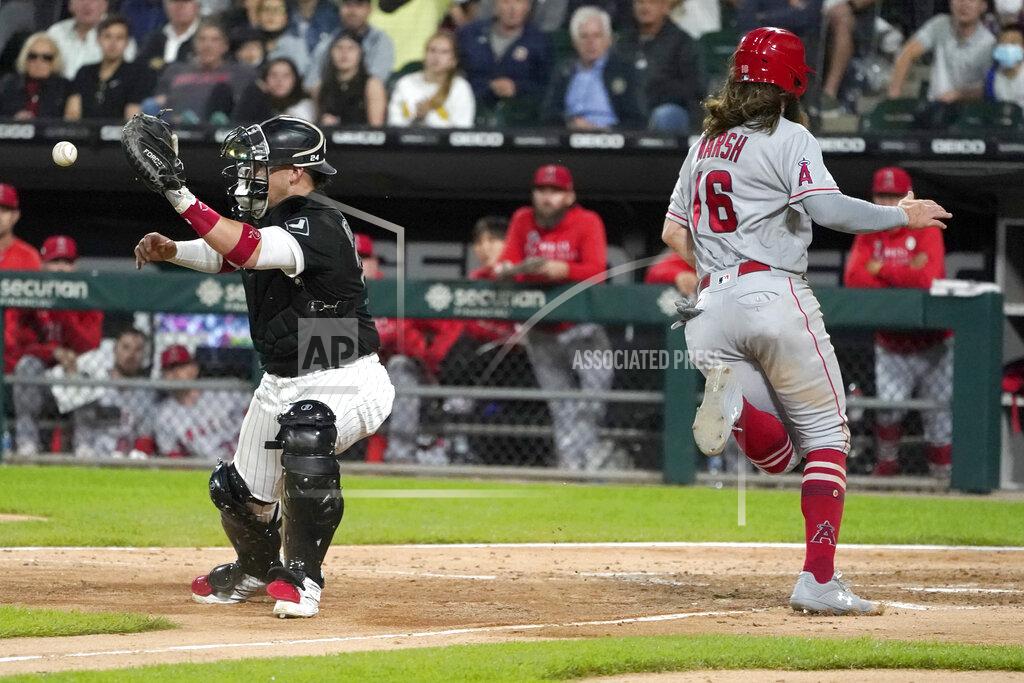 Charles Rex Arbogast Los Angeles Angels' Brandon Marsh (16) scores past Chicago White Sox catcher Yasmani Grandal during the sixth inning of a baseball game Wednesday, Sept. 15, 2021, in Chicago. (AP Photo/Charles Rex Arbogast)