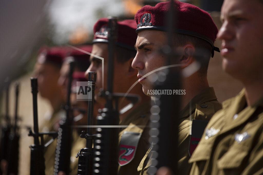 Maya Alleruzzo A military honor guard stands in formation at a ceremony marking the annual Holocaust Remembrance Day, at Yad Vashem Holocaust Memorial in Jerusalem, Thursday, April 8, 2021. (AP Photo/Maya Alleruzzo, Pool)