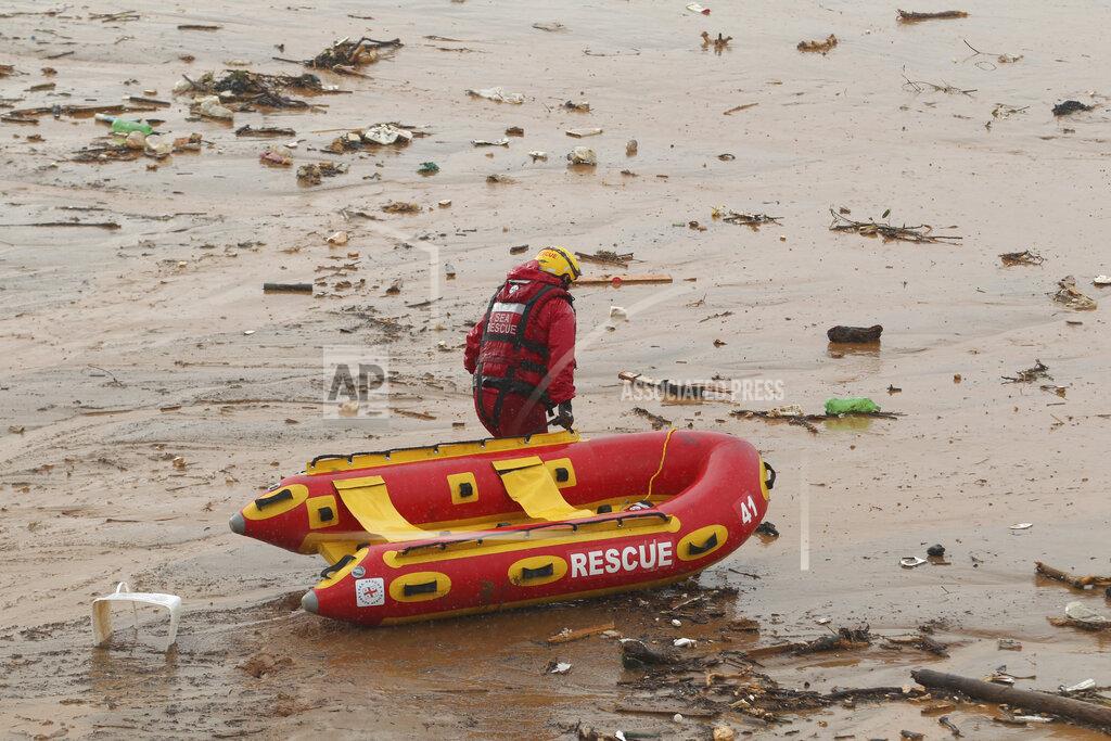Uncredited A rescuer makes his way through muddy waters on a beach near Durban, South Africa, Sunday, May 22, 2022. More than 300 people have been evacuated from their homes as a result of renewed heavy rains, flooding and mudslides in South Africa’s KwaZulu-Natal province, weeks after severe flooding killed more than 400 people and displaced more than 40,000 others. Provincial authorities and emergency personnel say the new rains have damaged roads, homes and electricity infrastructure largely in the northern parts of the province since Friday. (AP Photo)