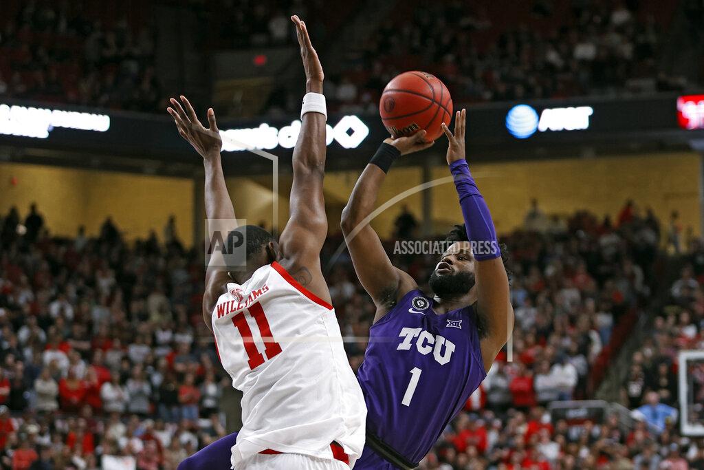 Brad Tollefson TCU's Mike Miles Jr. (1) shoots around Texas Tech's Bryson Williams (11) during the first half of an NCAA college basketball game on Saturday, Feb. 12, 2022, in Lubbock, Texas. (AP Photo/Brad Tollefson)