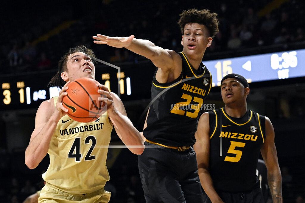 Mark Zaleski Vanderbilt forward Quentin Millora-Brown (42) shoots against Missouri forward Trevon Brazile (23) during the first half of an NCAA college basketball game Tuesday, Feb. 8, 2022, in Nashville, Tenn. (AP Photo/Mark Zaleski)