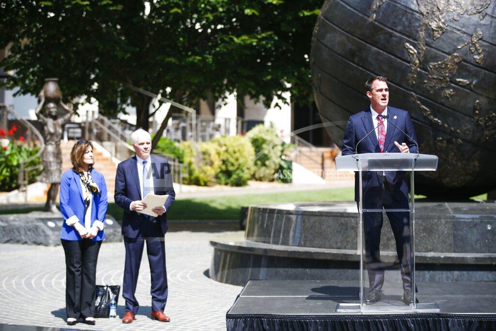 Michael Noble Jr. Oklahoma Gov. Kevin Stitt, right, speaks as he appoints John O'Connor as Oklahoma's Attorney General on Friday, July 23, 2021, in Tulsa, Okla. O'Connor fills a vacancy left in May when former Attorney General Mike Hunter stepped down suddenly. (Michael Noble Jr./Tulsa World via AP)