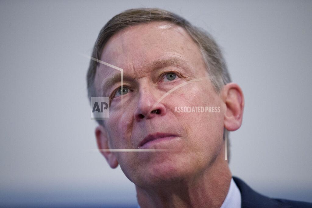 FILE - In this June 13 ,2019, file photo former Colorado Governor John Hickenlooper listens to a question during a media availability at the National Press Club in Washington. Hickenlooper was supposed to be Democrats' worry-free solution to the Colorado Senate race, but he's stumbled badly in the weeks leading up to the party's June 30 primary. (AP Photo/Alex Brandon, File)