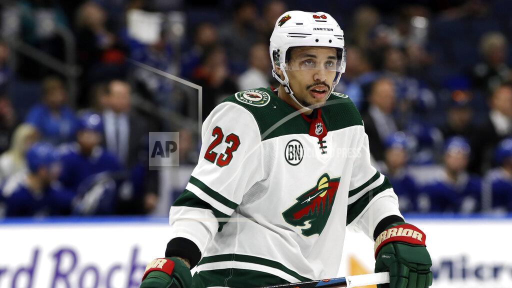 Chris O'meara FILE - This March 7, 2019 file photo shows Minnesota Wild right wing J.T. Brown during the third period of an NHL hockey game against the Tampa Bay Lightning in Tampa, Fla. The predominantly white sport of hockey has a checkered history of racism and a culture of not standing out from the team or speaking out. The death of George Floyd in Minnesota has shattered that silence. (AP Photo/Chris O'Meara, File)