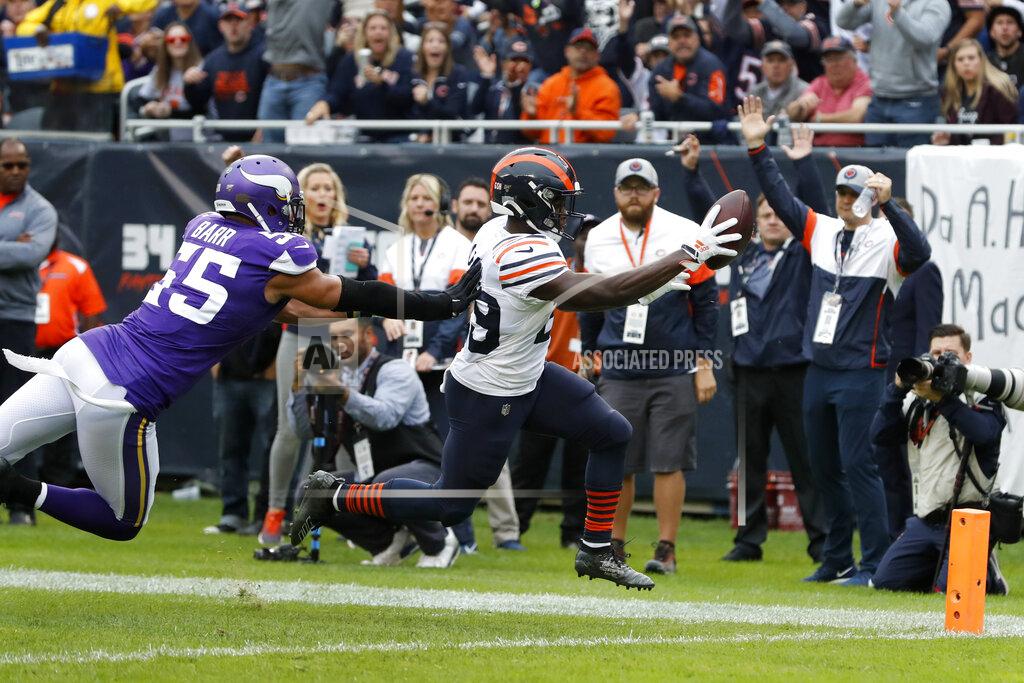 Charles Rex Arbogast Chicago Bears running back Tarik Cohen, right, scores past Minnesota Vikings outside linebacker Anthony Barr (55) during the half of an NFL football game Sunday, Sept. 29, 2019, in Chicago. (AP Photo/Charles Rex Arbogast)
