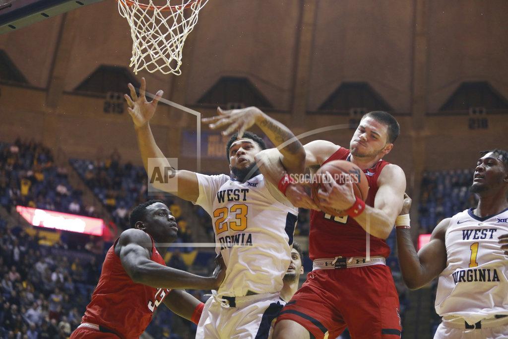 Ray Thompson West Virginia forward Esa Ahmad (23) and Texas Tech guard Matt Mooney (13) battle for a rebound during the second half of an NCAA college basketball game Wednesday, Jan. 2, 2019, in Morgantown, W.Va. Texas Tech defeated West Virginia 62-59. (AP Photo/Raymond Thompson)