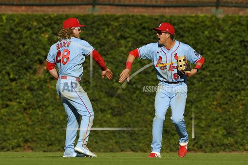 St. Louis Cardinals outfielders Lars Nootbaar, right, and Harrison Bader (48) celebrate after defeating the Chicago Cubs 8-5 in a baseball game Saturday, Sept. 25, 2021, in Chicago. (AP Photo/Paul Beaty)