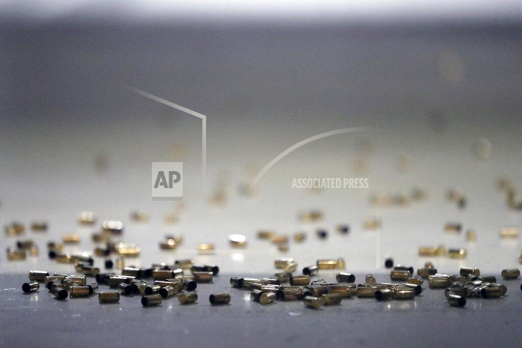 Shafkat Anowar Bullet casings lie on the floor at the shooting range of Maxon Shooter's Supplies and Indoor Range, Friday, April 30, 2021, in Des Plaines, Ill. After a year of pandemic lockdowns, mass shootings are back, but the guns never went away. As the U.S. inches toward a post-pandemic future, guns are arguably more present in the American psyche and more deeply embedded in American discourse than ever before. The past year's anxiety and loss fueled a rise in gun ownership across political and socio-economic lines. (AP Photo/Shafkat Anowar)