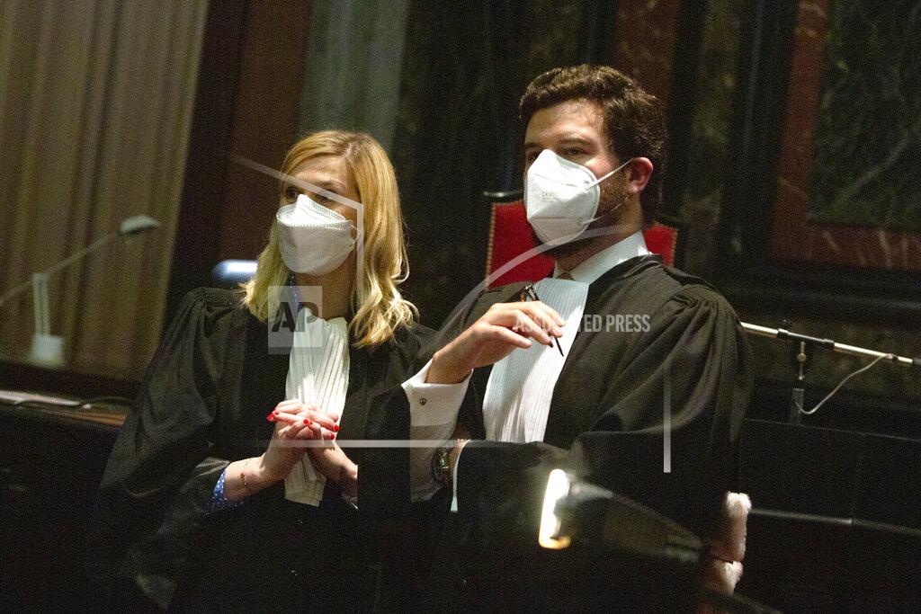 Virginia Mayo Lawyers for the European Commission Charles Edouard Lambert, right, and Fanny Laune speak prior to a hearing, European Commission vs AstraZeneca, at the main courthouse in Brussels, Wednesday, May 26, 2021. While the EU insists AstraZeneca has breached its contractual obligations, the company says it has fully complied with the agreement, arguing that vaccines are difficult to manufacture and it made its best effort to deliver on time. the European Union's executive branch will try to persuade a Brussels court Wednesday that the case is urgent enough to justify ordering the company to make an immediate delivery of the missing shots. (AP Photo/Virginia Mayo)