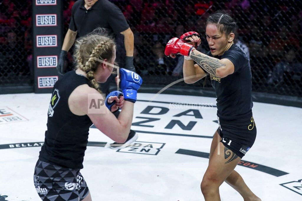 Ilima-Lei Macfarlane, right, battles with Kate Jackson during Bellator 236, Saturday, Dec. 21, 2019 in Honolulu. Bellator flyweight champion Ilima-Lei Macfarlane faces the most daunting challenge of her career Thursday, Dec. 10, 2020 against unbeaten contender Juliana Velasquez. (Lucas Noonan/MMA via AP)