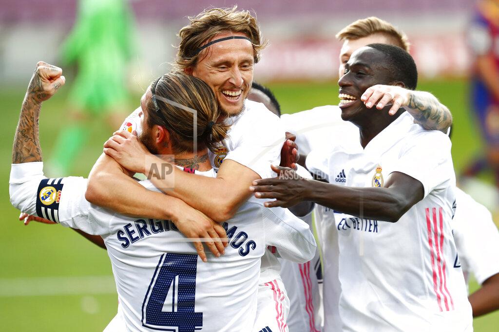 Joan Monfort Real Madrid's Luka Modric celebrates scoring his side's 3rd goal during the Spanish La Liga soccer match between FC Barcelona and Real Madrid at the Camp Nou stadium in Barcelona, Spain, Saturday, Oct. 24, 2020. (AP Photo/Joan Monfort)