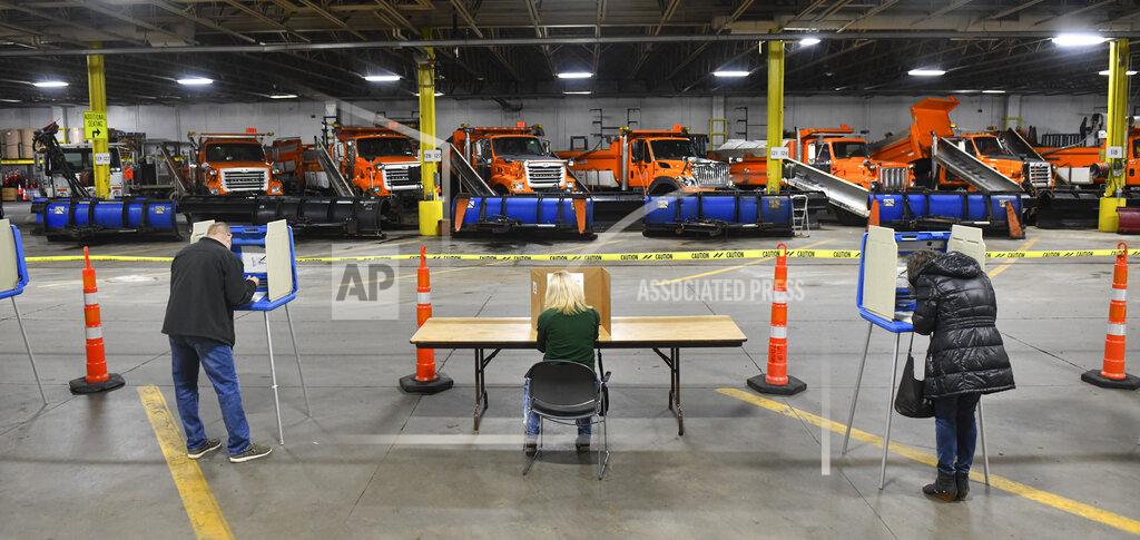 Dave Schwarz Voters cast ballots in the city's central maintenance facility Tuesday, Nov. 3, 2020, in St. Cloud, Minn. (Dave Schwarz/St. Cloud Times via AP)