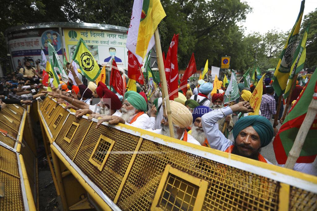 Manish Swarup Farmers shout anti government slogans during a protest in New Delhi, India, Thursday, July 22, 2021. More than 200 farmers on Thursday began a protest near India's Parliament to mark eight months of their agitation against new agricultural laws that they say will devastate their income. (AP Photo/Manish Swarup)