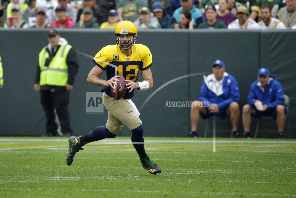 Mike Roemer Green Bay Packers quarterback Aaron Rodgers rolls out to pass during the first half of an NFL football game against the Denver Broncos, Sunday, Sept. 22, 2019, in Green Bay, Wis. (AP Photo/Mike Roemer)