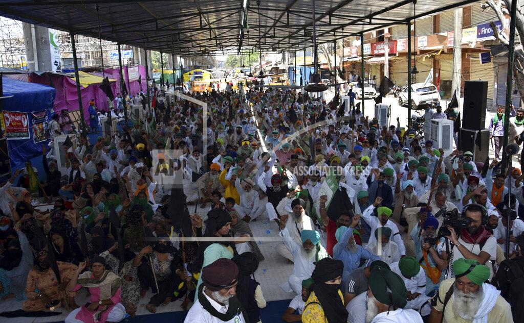 Dinesh Joshi Protesting farmers gather at Tikri Border, outskirts of New Delhi, India, Wednesday, May 26, 2021. Indian farmers demanding the government repeal new agriculture laws they say will devastate their livelihoods marked their protest movement's sixth month Wednesday by flying black banners on the cars and tractors and burning effigies of the prime minister. (AP Photo/Dinesh Joshi)