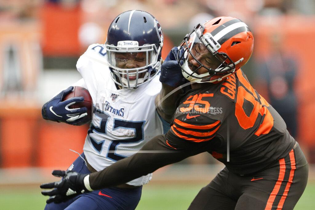 Ron Schwane Tennessee Titans running back Derrick Henry (22) called for a face mask penalty against Cleveland Browns defensive end Myles Garrett (95) during the second half in an NFL football game Sunday, Sept. 8, 2019, in Cleveland. (AP Photo/Ron Schwane)