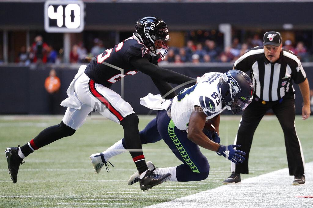 John Bazemore Atlanta Falcons cornerback Isaiah Oliver (26) pushes Seattle Seahawks wide receiver David Moore (83) out of bounds on a reception attempt during the first half of an NFL football game, Sunday, Oct. 27, 2019, in Atlanta. (AP Photo/John Bazemore)