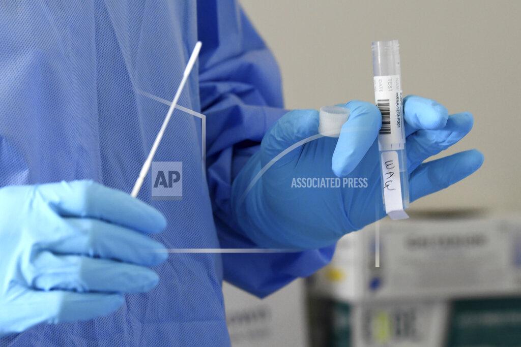 Taimy Alvarez University of Miami Miller School of Medicine nurse Loreta Padron prepares to test a volunteer for COVID-19, Wednesday, Sept. 2, 2020 in Miami. Miami is one of 89 cities around the U.S. that's testing the Moderna COVID-19 vaccine. (AP Photo/Taimy Alvarez)