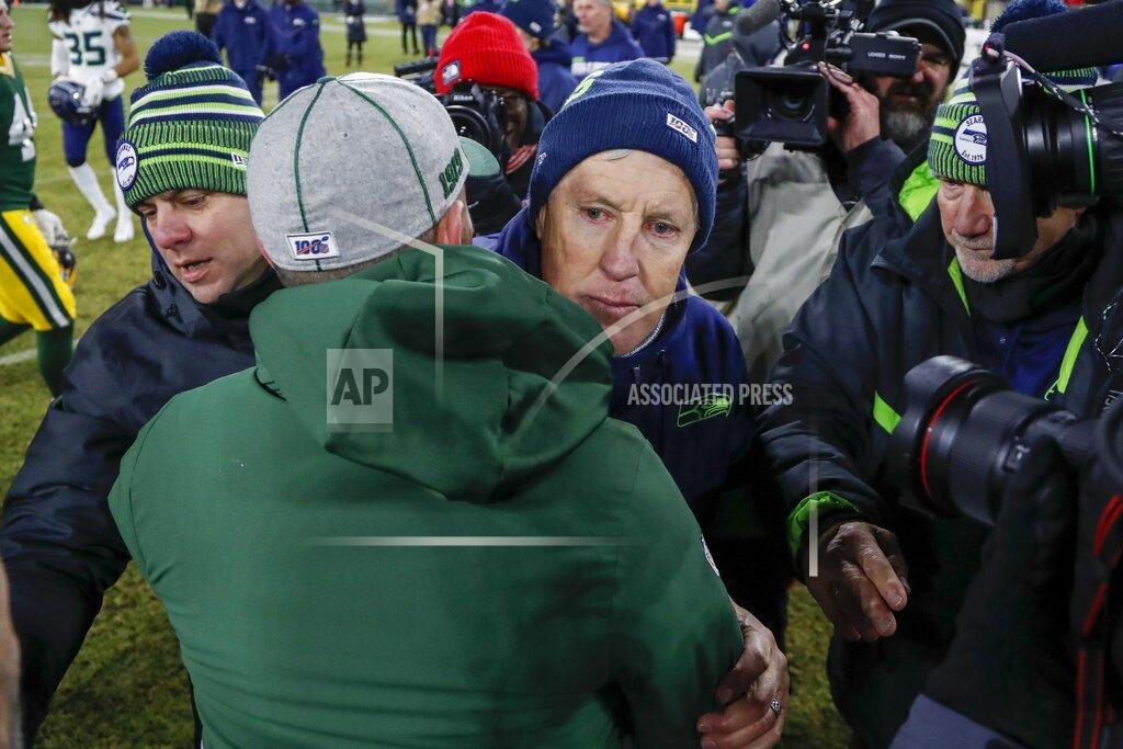 Matt Ludtke Seattle Seahawks head coach Pete Carroll talks to Green Bay Packers head coach Matt LaFleur after an NFL divisional playoff football game Sunday, Jan. 12, 2020, in Green Bay, Wis. The Packers won 28-23 to advance to the NFC Championship. (AP Photo/Matt Ludtke)
