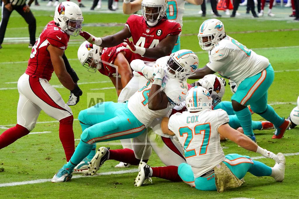 Rick Scuteri Miami Dolphins running back Jordan Howard, center, scores a touchdown against the Arizona Cardinals during the first half of an NFL football game, Sunday, Nov. 8, 2020, in Glendale, Ariz. (AP Photo/Rick Scuteri)