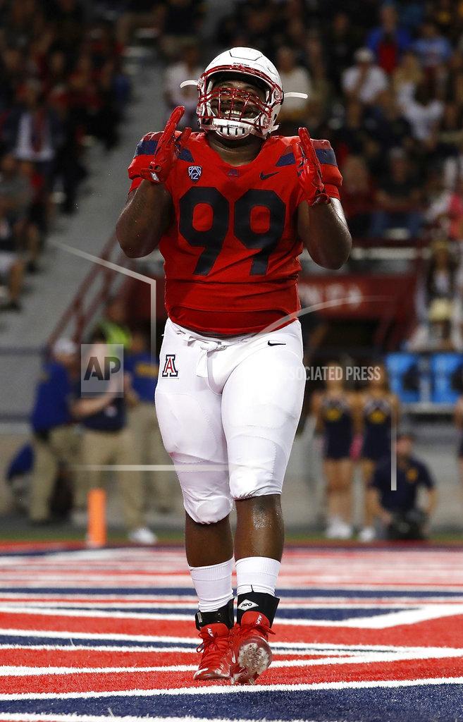 Chris Coduto Arizona defensive tackle Dereck Boles smiles after a fourth-down stop during the second half of the team's NCAA college football game against California on Saturday, Oct. 6, 2018, in Tucson, Ariz. (AP Photo/Chris Coduto)