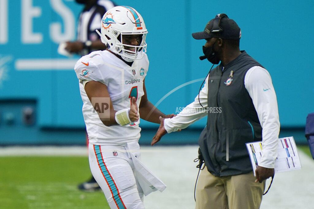 Lynne Sladky Miami Dolphins head coach Brian Flores congratulates quarterback Tua Tagovailoa (1) after a touchdown, during the first half of an NFL football game against the Los Angeles Rams, Sunday, Nov. 1, 2020, in Miami Gardens, Fla. (AP Photo/Lynne Sladky)