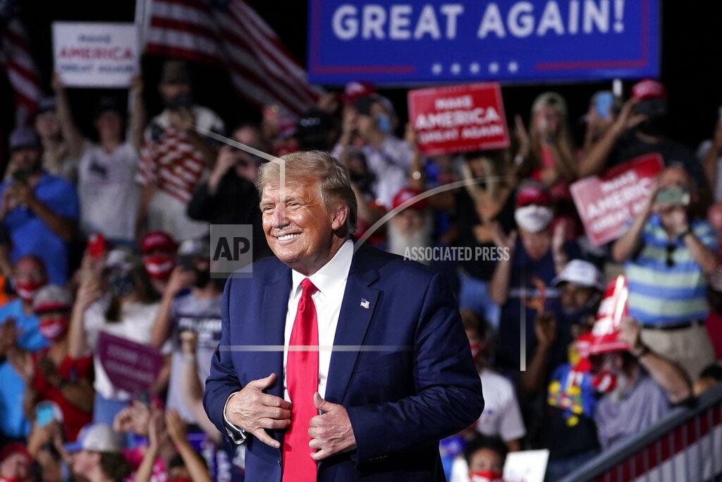 Evan Vucci FILE - In this Sept. 8, 2020, file photo President Donald Trump stands on stage after speaking at a campaign rally at Smith Reynolds Airport in Winston-Salem, N.C. Senior aides describe North Carolina as a “must-win" for the Republican president. A loss in North Carolina, which Democrats have carried only once at the presidential level in the last 30 years, would make Trump's path to a second term incredibly difficult and signal dire challenges elsewhere on the electoral map. (AP Photo/Evan Vucci, File)