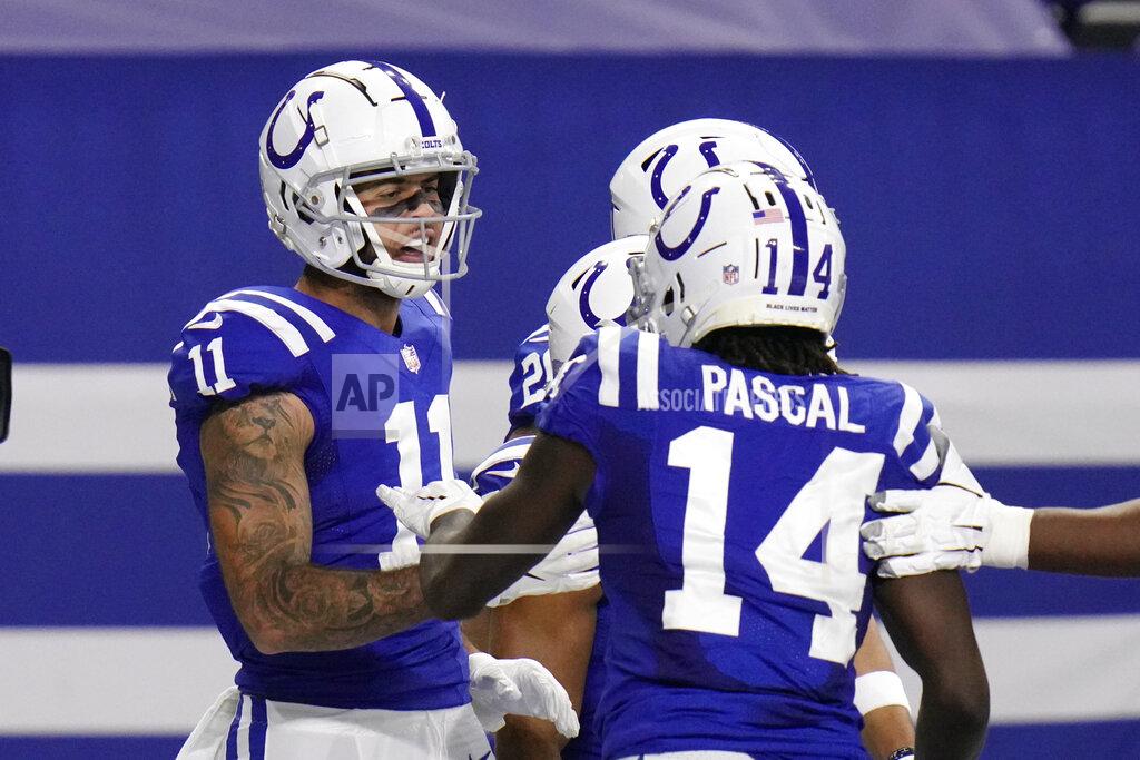 Aj Mast Indianapolis Colts' Michael Pittman (11) celebrates a touchdown reception with teammates during the first half of an NFL football game against the Green Bay Packers, Sunday, Nov. 22, 2020, in Indianapolis. (AP Photo/AJ Mast)