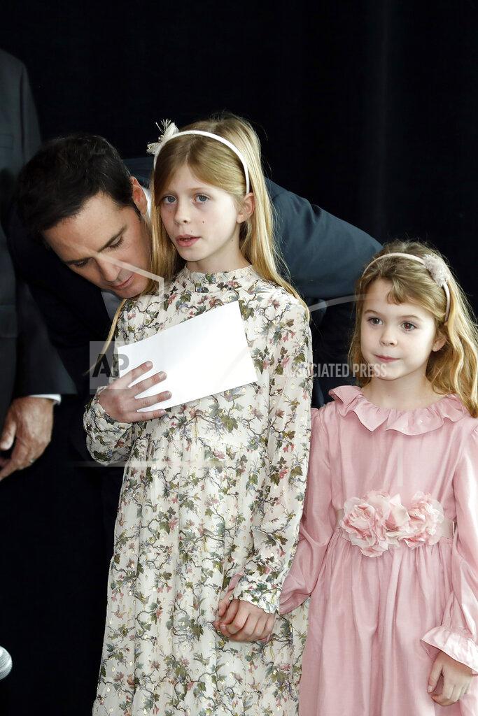 Bob Leverone Jimmie Johnson has a word with his oldest daughter, Genevieve, as daughter Lydia waits to take the stage during his NASCAR retirement announcement at Hendrick Motorsports near Charlotte, N.C., Thursday, Nov. 21, 2019. (AP Photo/Bob Leverone)