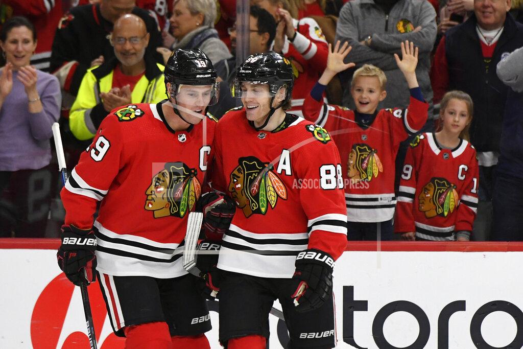 Paul Beaty FILE - Chicago Blackhawks' Patrick Kane (88) celebrates with teammate Jonathan Toews (19) after scoring a hat trick during the third period of an NHL hockey game against the Minnesota Wild in Chicago, in this Sunday, Dec. 15, 2019, file photo. The Chicago Blackhawks are going to remain the Blackhawks — and there is no sign of any change coming anytime soon. Speaking publicly Thursday, Dec. 17, 2020, for the first time since baseball's Cleveland Indians announced Monday they plan to change their name, Blackhawks CEO Danny Wirtz reiterated the same message the team shared this summer after lingering questions about Native American team names returned to the forefront. (AP Photo/Paul Beaty, File)