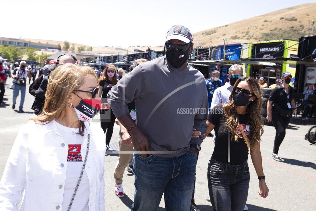 D. Ross Cameron Former NBA basketball player Michael Jordan, center, visits racing teams before a NASCAR Cup Series race, Sunday, June 6, 2021, at Sonoma Raceway in Sonoma, Calif. (AP Photo/D. Ross Cameron)