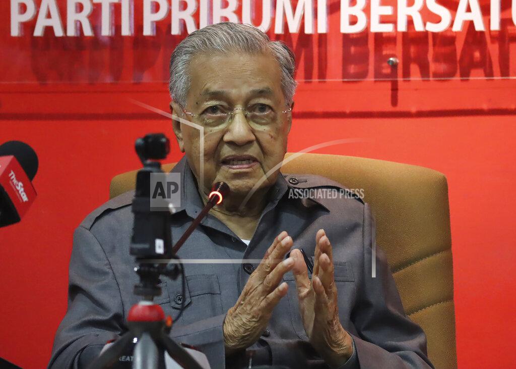 Uncredited Former Prime Minister Mahathir Mohamad speaks during a press conference at his party headquarters in Petaling Jaya, Malaysia, Friday, May 29, 2020. Mahathir has been ousted from his Malay party in the latest twist to a power struggle with his successor Muhyiddin Yassin, but he has vowed to challenge it. (AP Photo)