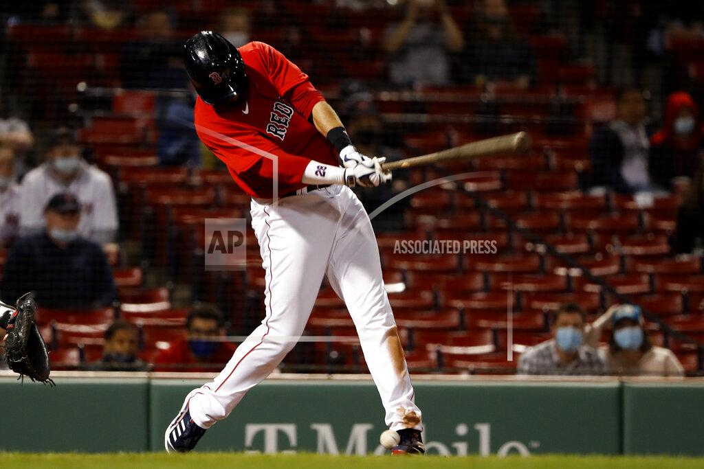 Winslow Townson Boston Red Sox's J.D. Martinez fouls a ball off his foot during the seventh inning of a baseball game against the Toronto Blue Jays Tuesday, April 20, 2021, at Fenway Park in Boston. (AP Photo/Winslow Townson)