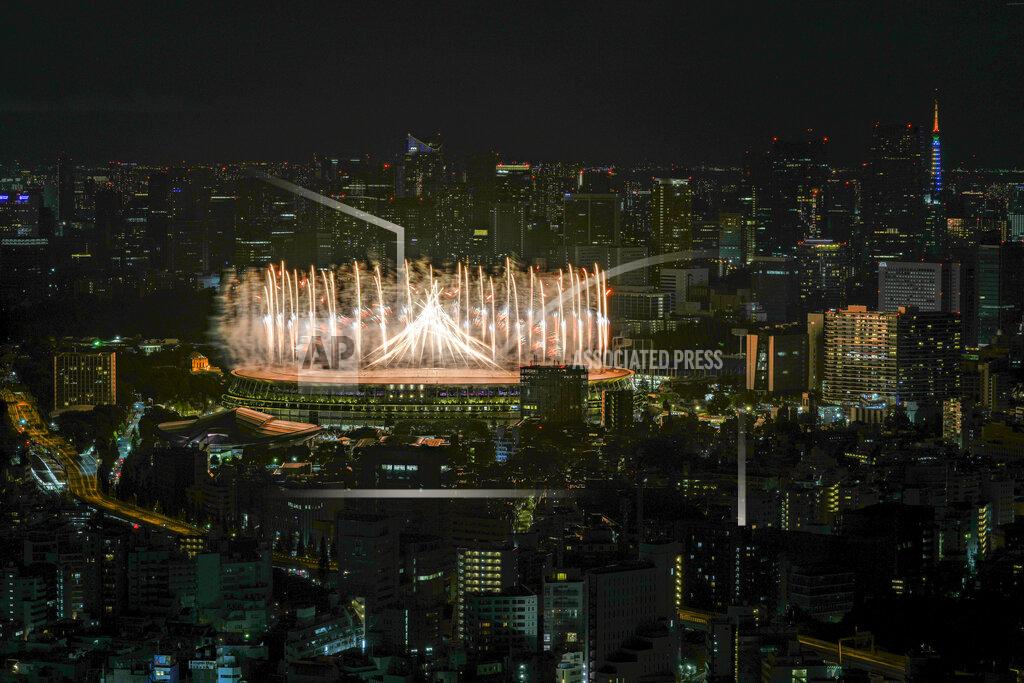 Kiichiro Sato Fireworks illuminate over National Stadium during the opening ceremony of the 2020 Tokyo Olympics, Friday, July 23, 2021, in Tokyo. (AP Photo/Kiichiro Sato)