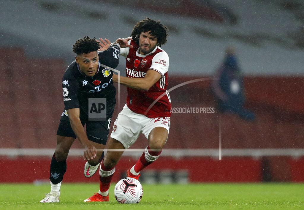 Alastair Grant Aston Villa's Ollie Watkins, left, duels for the ball with Arsenal's Mohamed Elneny during the English Premier League soccer match between Arsenal and Aston Villa at the Emirates stadium in London, Sunday, Nov. 8, 2020. (AP Photo/Alastair Grant, Pool)