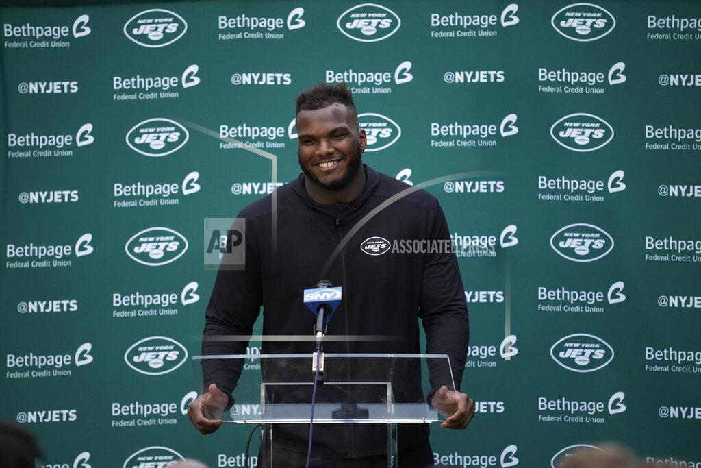 Matt Dunham New York Jets' defensive lineman John Franklin-Myers speaks during a press conference after an NFL practice session at Hanbury Manor Marriott Hotel and Country Club near the town of Ware in south east England, Friday, Oct. 8, 2021. The New York Jets are preparing for an NFL regular season game against the Atlanta Falcons in London on Sunday. (AP Photo/Matt Dunham)