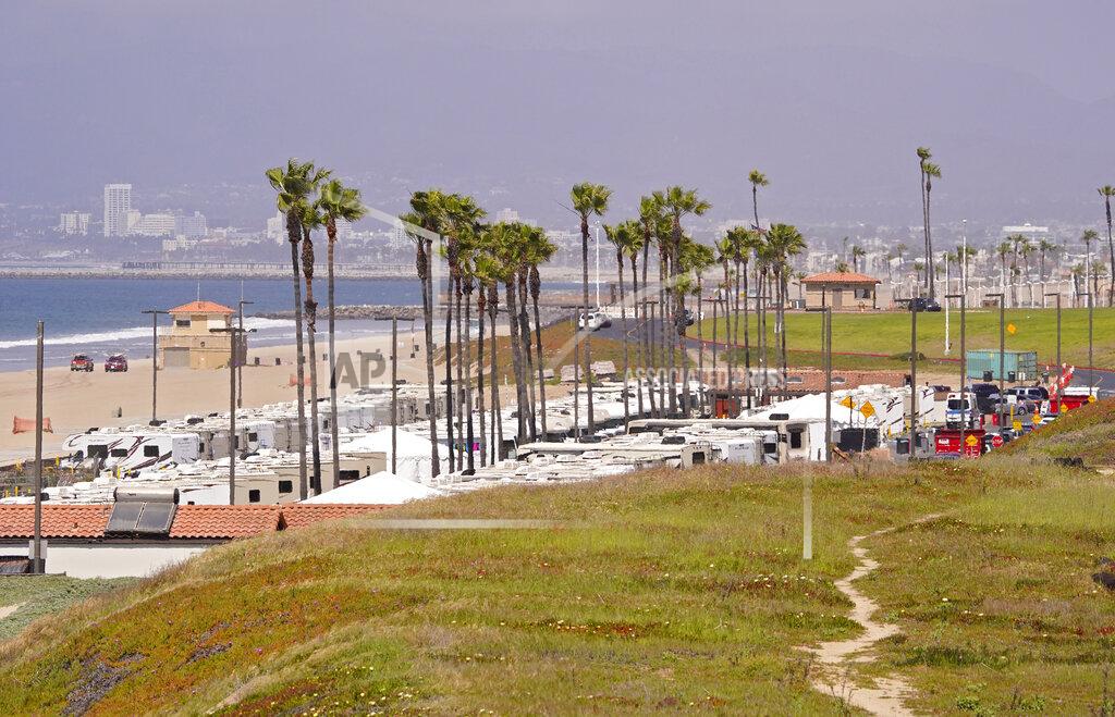 Mark J. Terrill An RV park at Dockweiler State Beach is seen where some coronavirus patients are being quarantined, Friday, April 3, 2020, in Los Angeles. The new coronavirus causes mild or moderate symptoms for most people, but for some, especially older adults and people with existing health problems, it can cause more severe illness or death. (AP Photo/Mark J. Terrill)